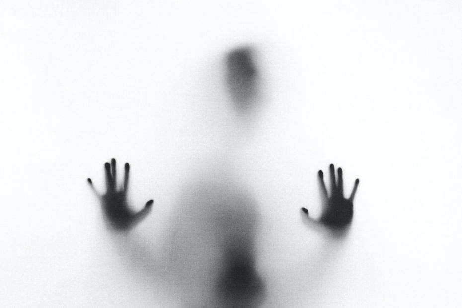 person behind fog glass