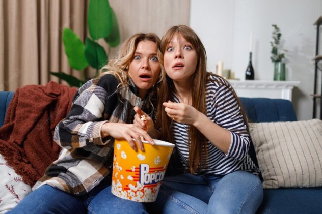 mother-daughter-having-fun-spending-leisure-time-together-home-watching-scary-movie_153608-7822.jpg