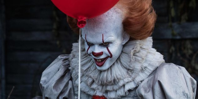 The Lovecraftian Horror Monster Pennywise Gives a Creepy Smile in the It Movie Starring Bill Skarsgard in 2017 Featuring the Iconic Red Balloon.