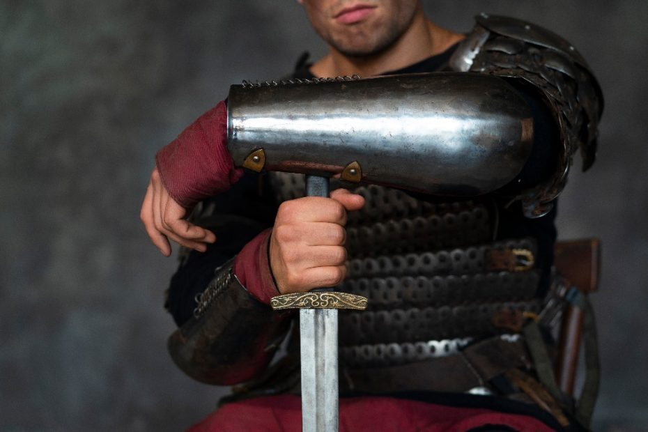 front-view-medieval-soldier-posing-studio